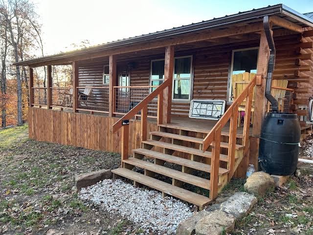 Secluded off grid cabin located on mountain ridge looking down beautiful valley, Arkansas